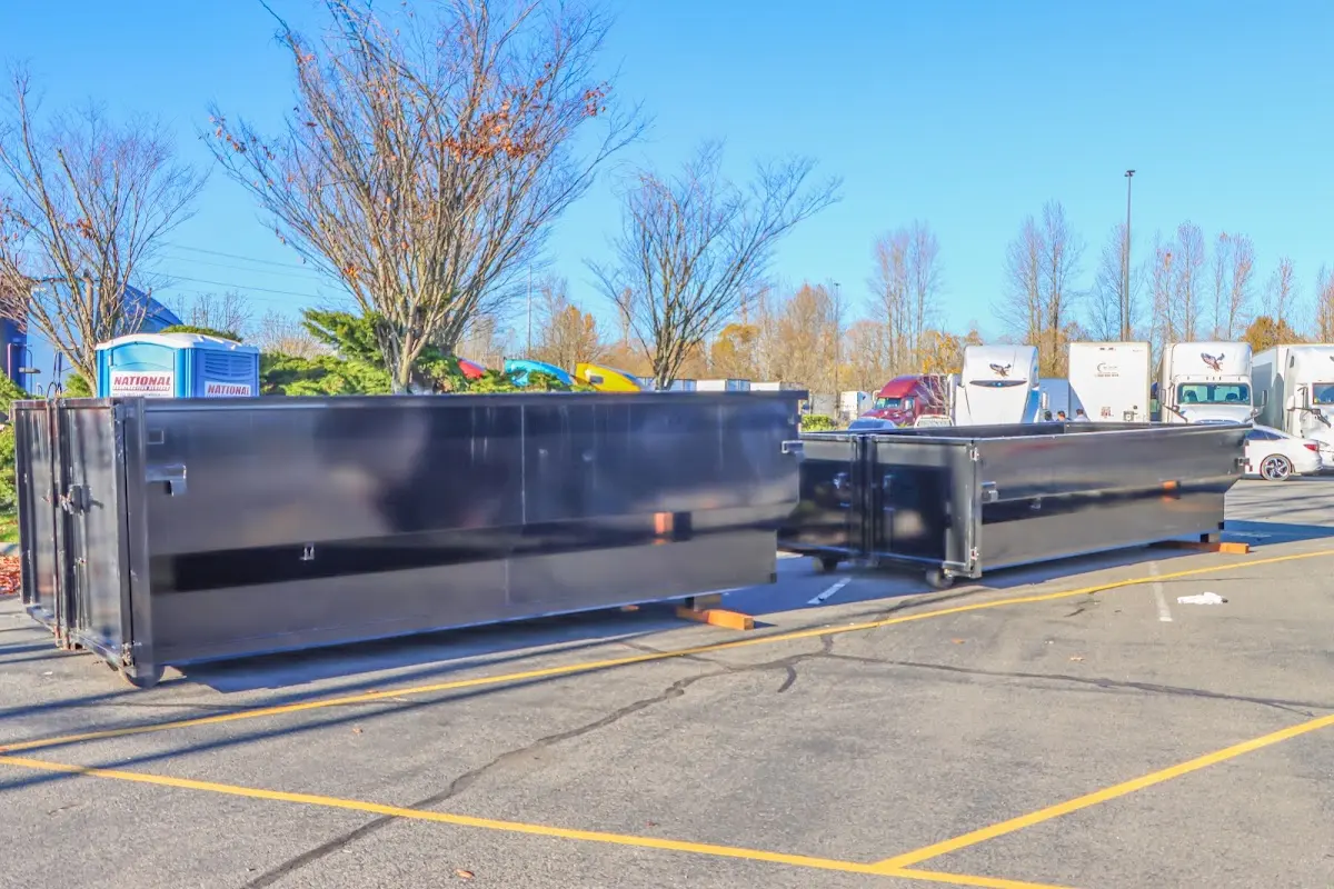 Professional dumpster rental service with roll-off container on residential driveway in Lake Stevens